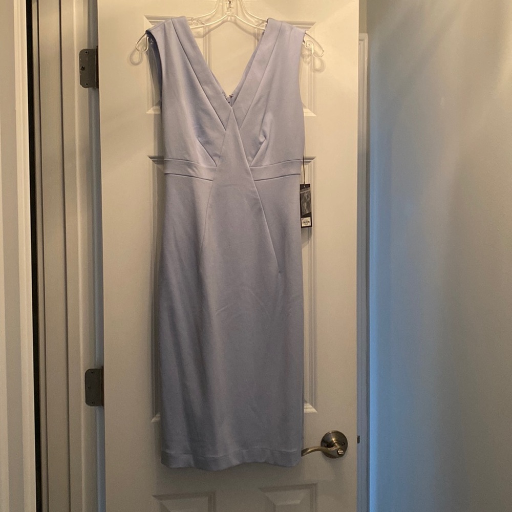 Sleeveless, light blue workwear dress. Size 6. Never worn, tags still on.